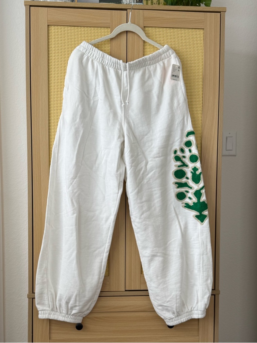 FP Movement by Free People White Track Pants with Green Side Graphic